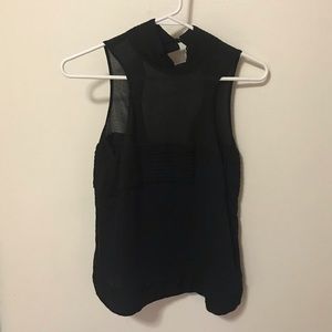 Black sleeveless turtleneck top